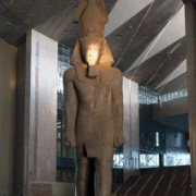 Sunlight illuminating the face of Ramses II during the Sun Alignment at the Grand Egyptian Museum, showcasing ancient Egyptian engineering and cultural heritage in Cairo.